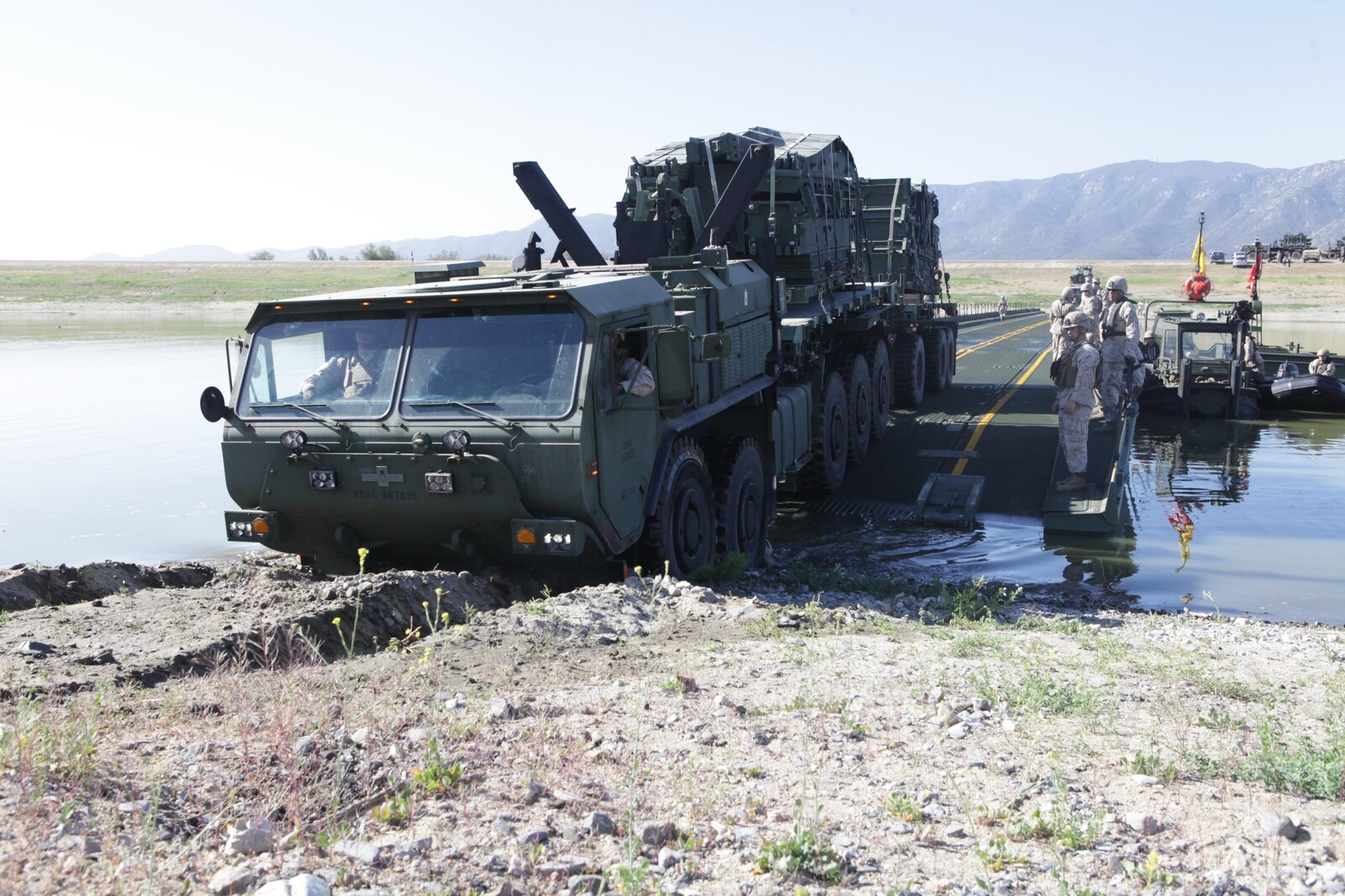 Marines from Bridge Company, 7th Engineer Support Battalion, 1st Marine Logistics Group, conduct a bridge exercise at Lake Elsinore, Calif., March 24. Marines built an Improved Ribbon Bridge and a Medium Girder Bridge.