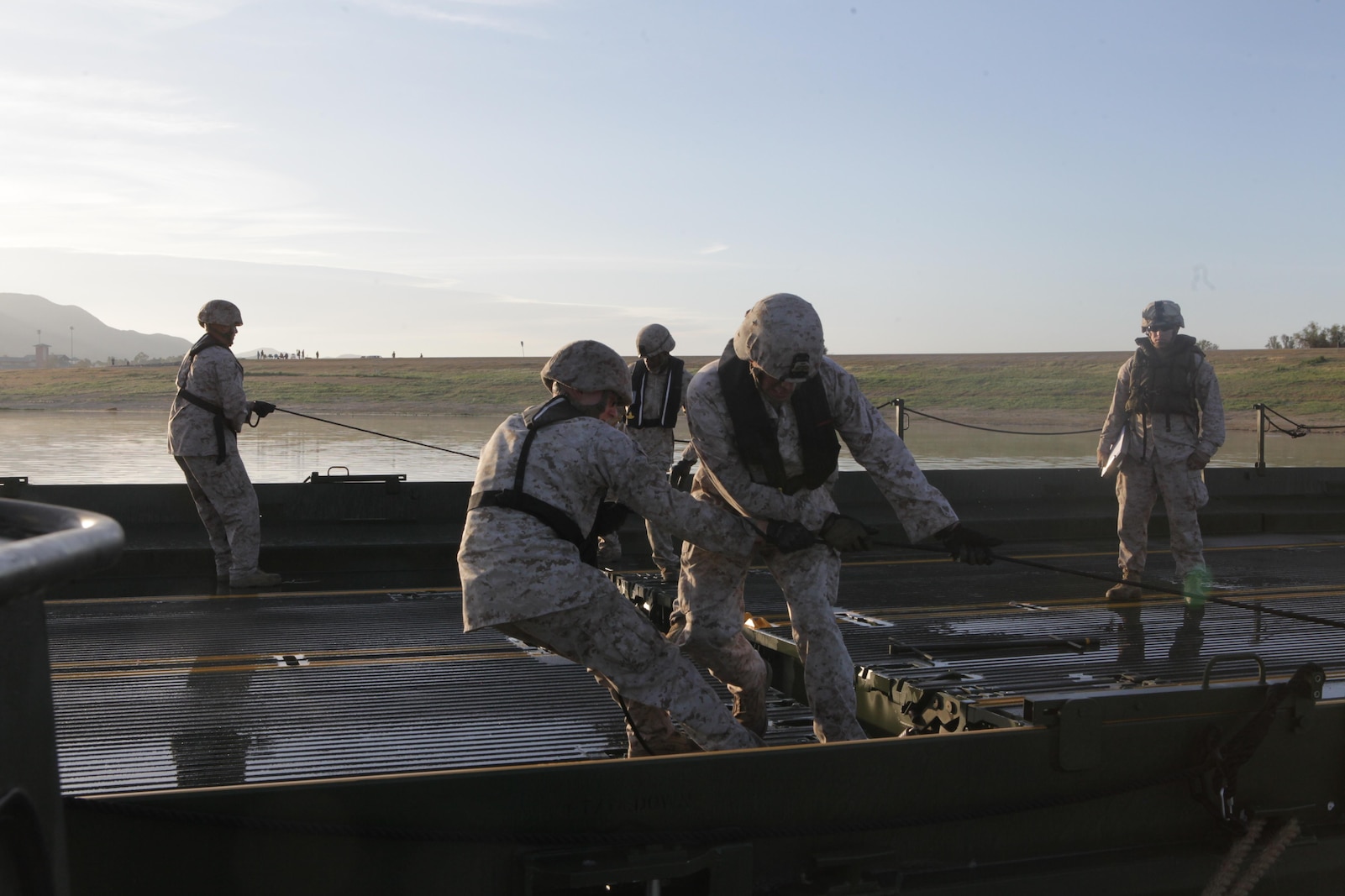 Marines from Bridge Company, 7th Engineer Support Battalion, 1st Marine Logistics Group, conduct a bridge exercise at Lake Elsinore, Calif., March 24. Marines built an Improved Ribbon Bridge and a Medium Girder Bridge.