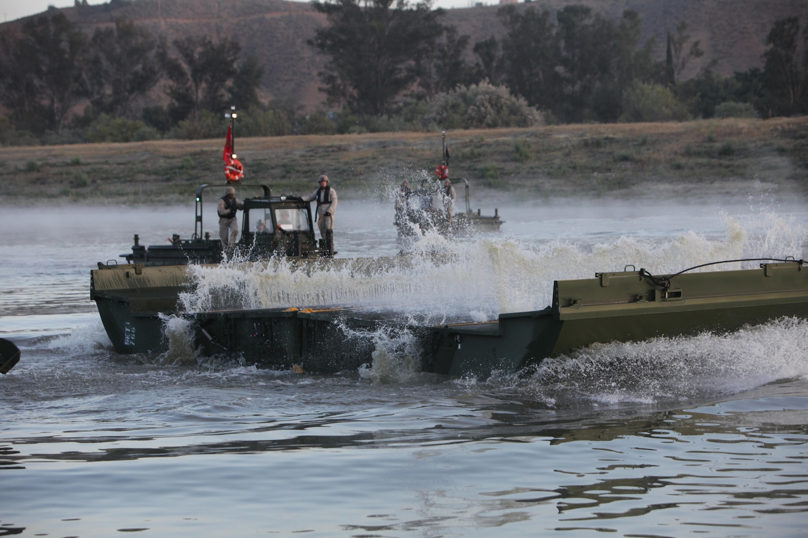 Marines from Bridge Company, 7th Engineer Support Battalion, 1st Marine Logistics Group, conduct a bridge exercise at Lake Elsinore, Calif., March 24. Marines built an Improved Ribbon Bridge and a Medium Girder Bridge.