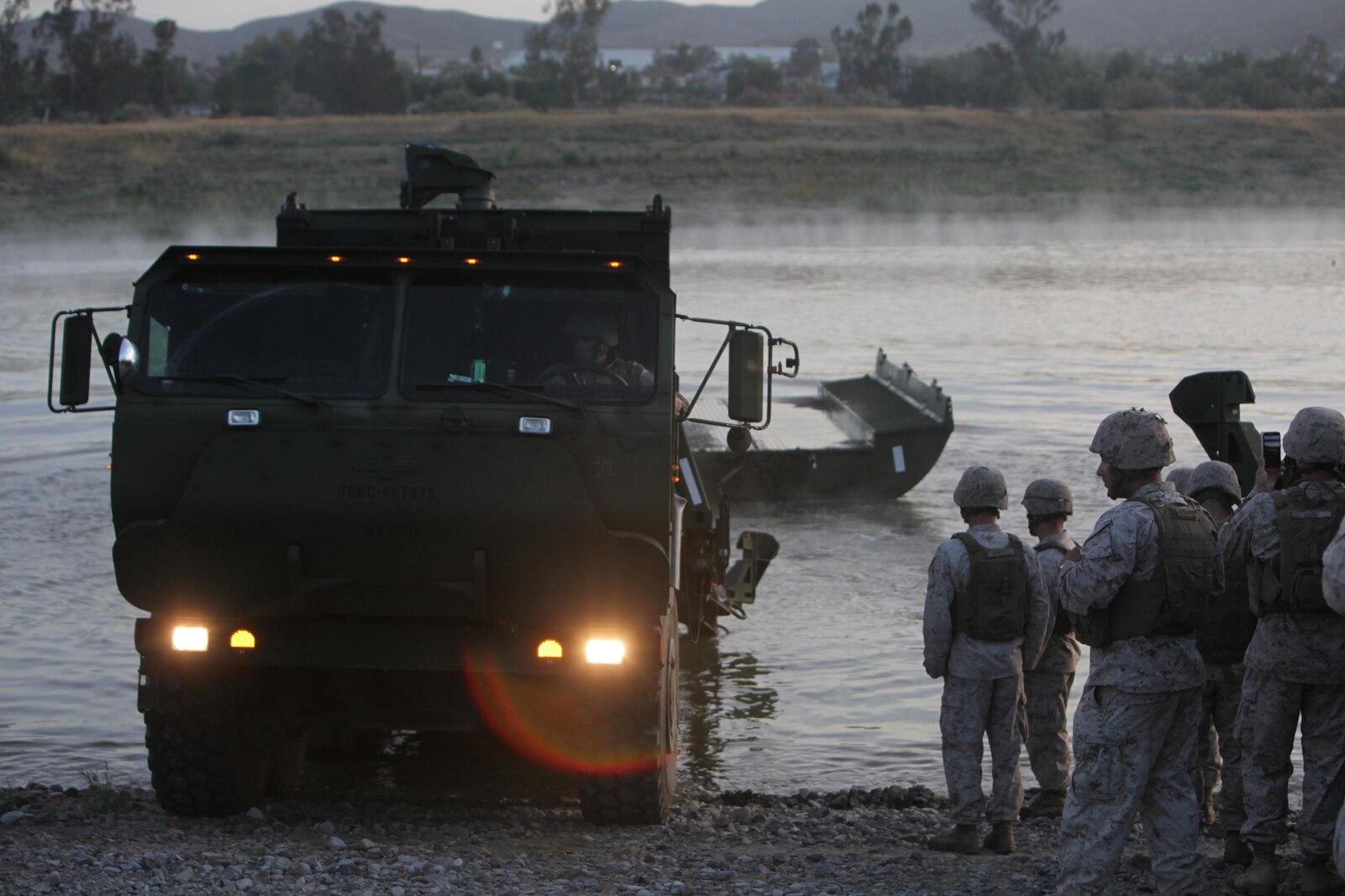 Marines from Bridge Company, 7th Engineer Support Battalion, 1st Marine Logistics Group, conduct a bridge exercise at Lake Elsinore, Calif., March 24. Marines built an Improved Ribbon Bridge and a Medium Girder Bridge.