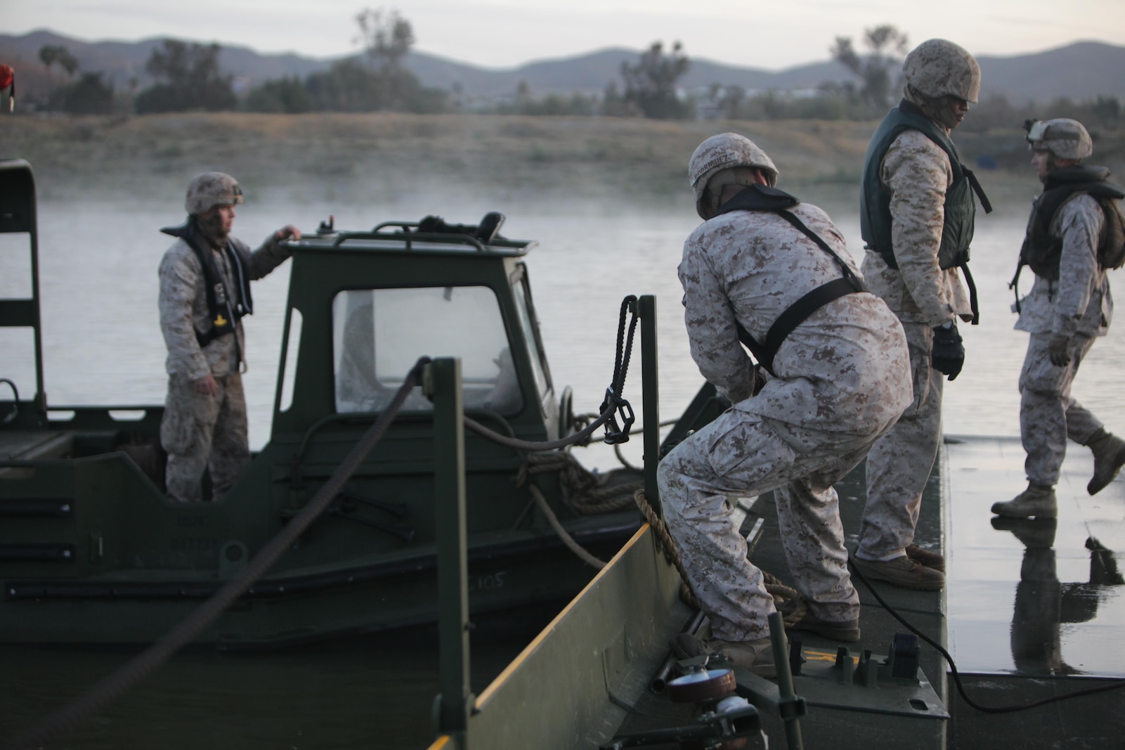 Marines from Bridge Company, 7th Engineer Support Battalion, 1st Marine Logistics Group, conduct a bridge exercise at Lake Elsinore, Calif., March 24. Marines built an Improved Ribbon Bridge and a Medium Girder Bridge.