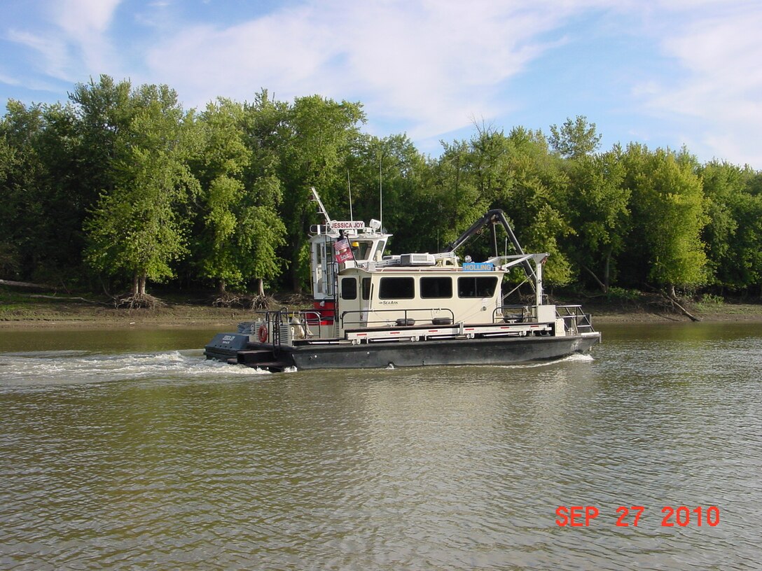 Survey Vessel Holling accompanied by the Jessica Joy on the Mississippi River.