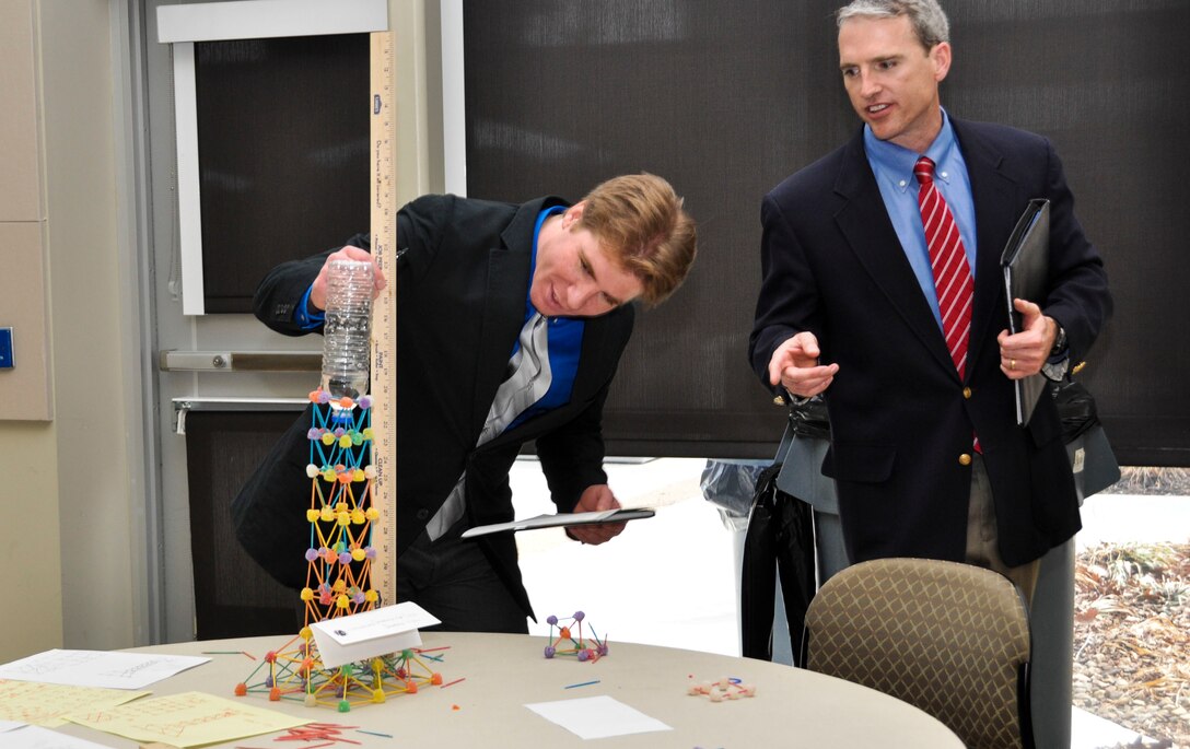 WINCHESTER - Judges measure the height of water to determine the winner of the tower construction project by local high school students in the design/build activity portion during the U.S. Army Corps of Engineers, Middle East District’s annual Day With an Engineer March 19 at Lord Fairfax Community College’s Middletown campus.