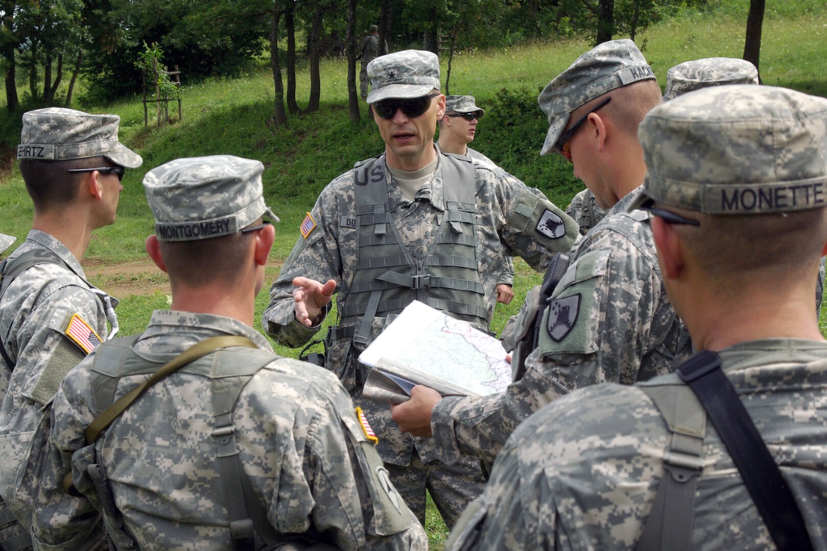 Army Brig. Gen. Al Dohrmann, a North Dakota National Guard member and
commander of Multinational Battle Group East, talks to troops from Bravo
Company, 2nd Platoon, after a patrol near the border between Kosovo and the
Former Yugoslavian Republic of Macedonia during quick reaction force
exercises June 22, 2010. 