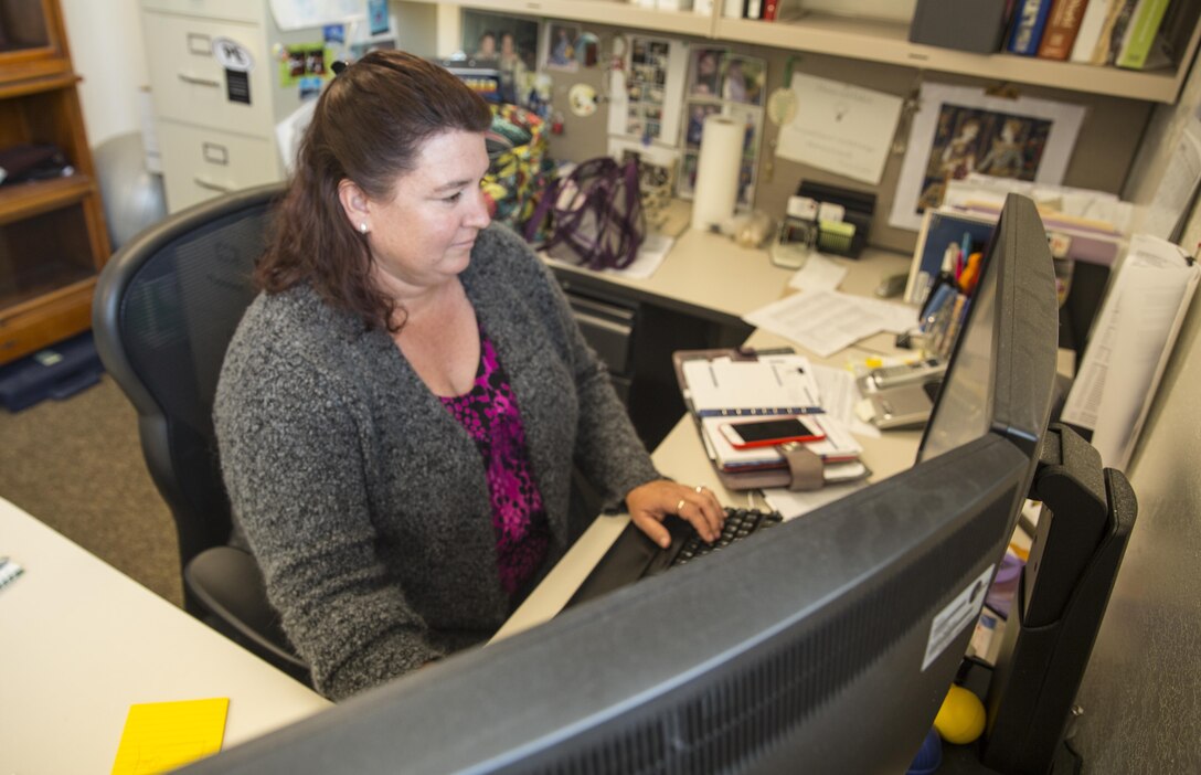 Megan Blucher, engineering branch manager, Marine Corps Air Station Miramar, works on her computer aboard MCAS Miramar, Calif., March 23. Blucher received the Federal Engineer of the Year Award as the Marine Corps’ top engineer in 2014.