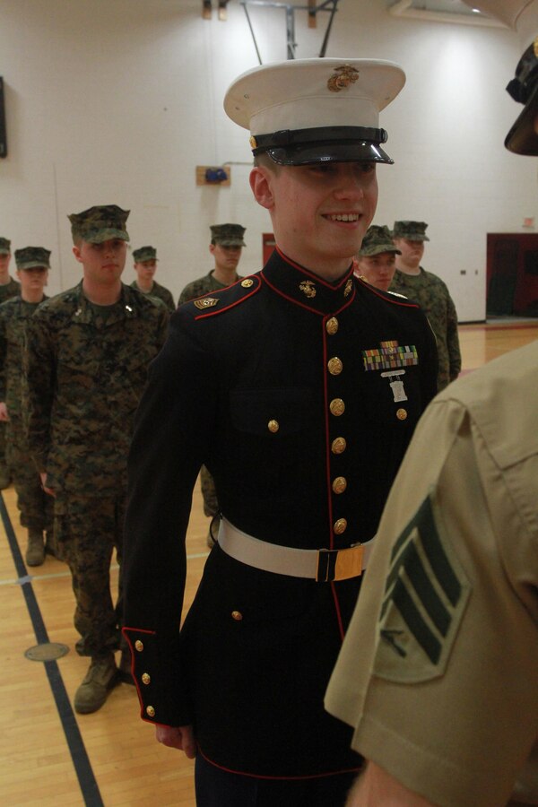 Ryan J. Dotson, a St. Albans High School senior and fouth-year Marine Corps Junior Reserve Officer’s Training Corps cadet, answers leadership questions during a biannual inspection by local Marines March 10, 2015, in St. Albans, West Virginia. Marines judge the students on their confidence, attention to detail, leadership traits and teamwork.  (U.S. Marine Corps photo by Sgt. Caitlin Brink/Released)