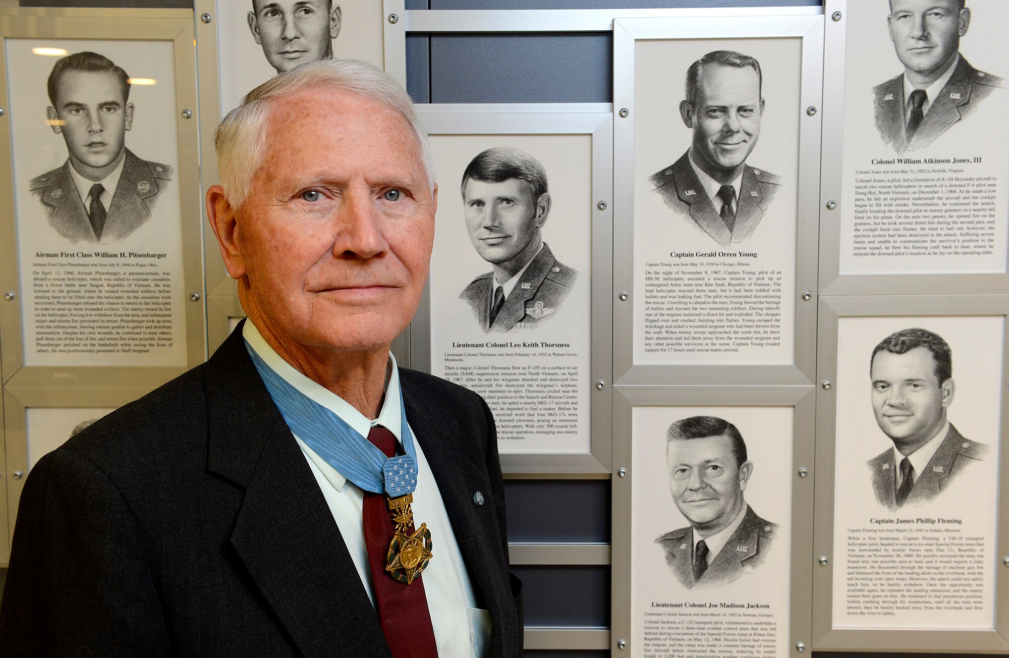 Retired Col. Leo Thorsness poses with a permanent Medal of Honor display March 24, 2015, at the Pentagon in Washington D.C. The display depicts him and other medal recipients.  Thorsness was in the Pentagon with fellow Medal of Honor recipient, Joe Jackson for a Q-and-A session with members of the Air Staff, hosted in the Hall of Heroes.  Jackson and Thorsness also met with Secretary of the Air Force Deborah Lee James and Air Force Vice Chief of Staff Gen. Larry Spencer. (U.S. Air Force photo/Scott M. Ash) 