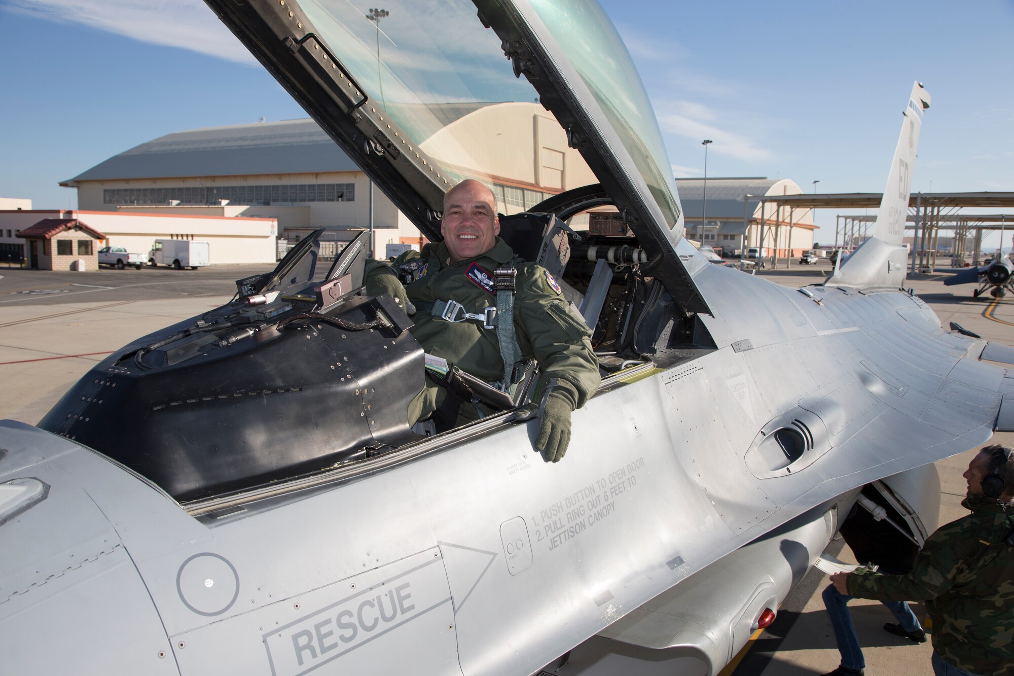 Brig. Gen. Michael T. Brewer poses for a photo in the cockpit of an F-16 Fighting Falcon before taking off on his final proficiency flight at Edwards Air Force Base March 23. After serving almost three years as 412th Test Wing commander, Brewer will continue to serve the Air Force in a new assignment at Headquarters, Air Force Materiel Command. (U.S. Air Force photo by Christian Turner)