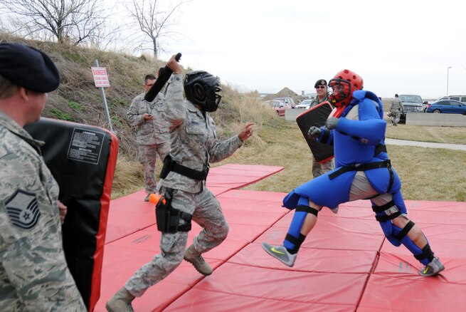 Master Sgt. Shatiece Werner, 151st Security Forces Squadron, uses a baton to 
subdue a simulated attacker during a training exercise at the Roland R. Wright 
Air National Guard Base, Utah, on March 11, 2015. (Air National Guard photo by Staff Sgt. Annie Edwards/RELEASED)