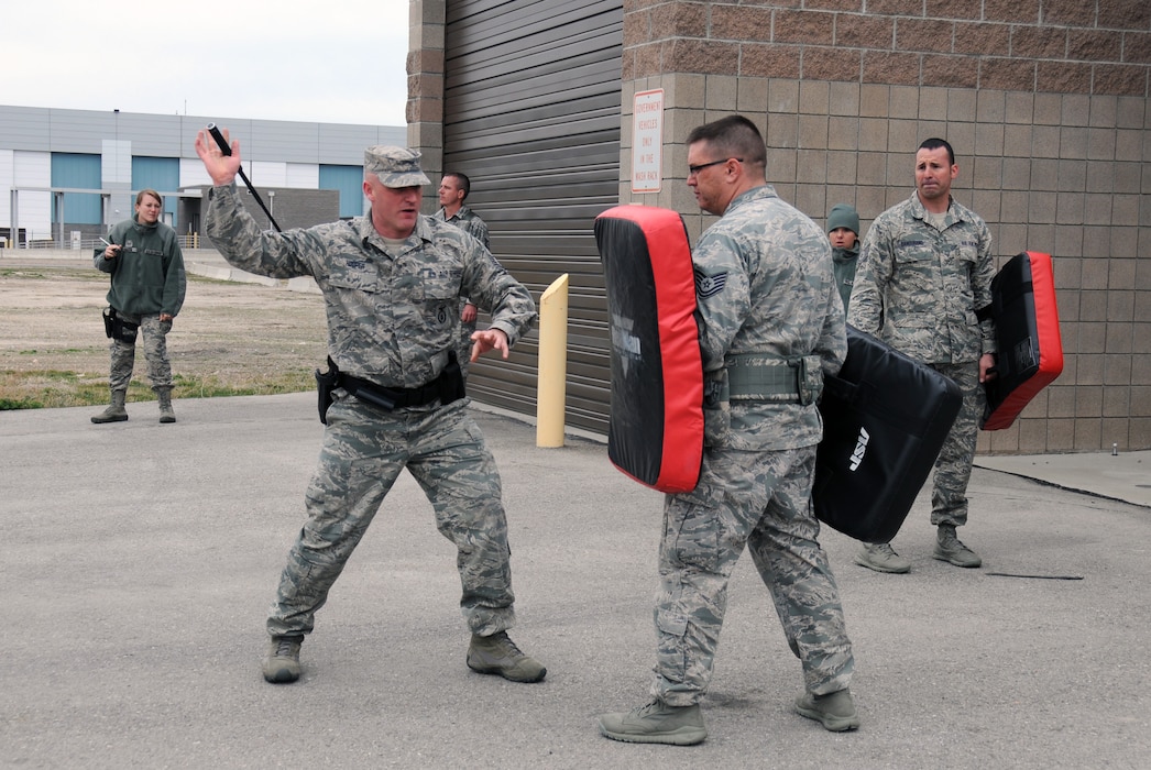 Master Sgt. Mitchell Hooper demonstrates baton techniques to members of the 
151st Security Forces Squadron during the combatives portion of the unit's 
annual training at the Roland R. Wright Air National Guard Base, Utah, on 
March 11, 2015. (Air National Guard photo by Staff Sgt. Annie Edwards/RELEASED)