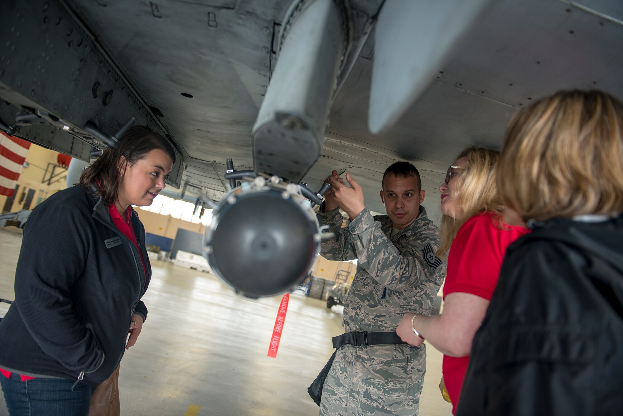 U.S. Air Force Tech. Sgt. Greg Boggs, 23d Maintenance Group loading standardization crew member, talks to members of Leadership Lowndes Class of 2015 during their annual Defense Day visit March 19, 2015 at Moody Air Force Base, Ga. Members of the 23d MXG demonstrated how to load an A-10 Thunderbolt II, giving the Leadership Lowndes members a firsthand look at what Moody Airmen do every day.  (U.S. Air Force photo by Andrea Jenkins/Released)




