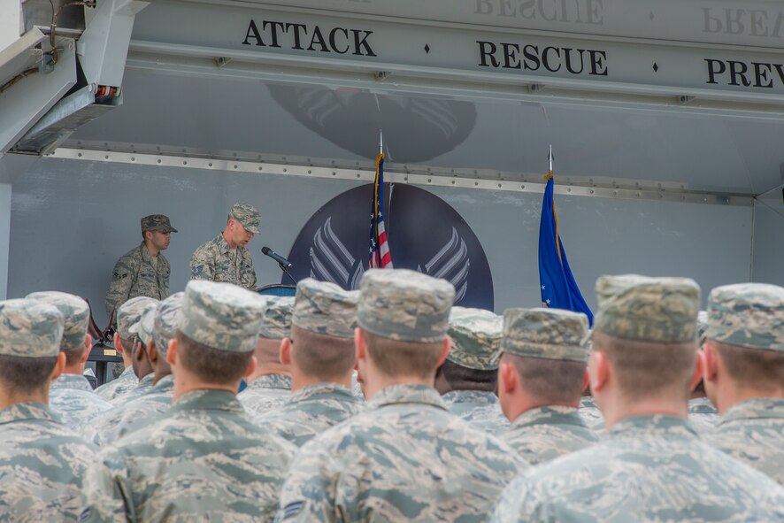 U.S. Air Force Tech. Sgt. Isaac Price, 23d Component Maintenance Squadron aerospace propulsion craftsman, narrates during the Clements McMullen Memorial Daedalian Weapon System Maintenance Trophy presentation March 23, 2015, at Moody Air Force Base, Ga. Air Combat Command awarded the 23d MXG with the Daedalian Trophy for their efforts conducting aircraft and munitions maintenance during fiscal year 2014. (U.S. Air Force photo by Airman Greg Nash/Released)