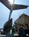 One of three Army tactical base of operations vehicles from the 2nd Brigade, 25th Infantry Division, sits just outside of a C-17 Globemaster III from the 535th Airlift Squadron on Joint Base Pearl Harbor-Hickam, Hawaii, March 18, 2015. The vehicle will be loaded into the C-17 as part of joint training between the Army and Air Force. The training is designed to familiarize Air force loadmasters and Army infantrymen on proper procedures for uploading and securing vehicles into a C-17. (U.S. Air Force photo by Tech. Sgt. Aaron Oelrich/Released)      