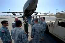Staff Sgt. Dylan Porras, a loadmaster from the 535th Airlift Squadron, gives a safety briefing to soldiers from the 2nd Brigade, 25th Infantry Division, before conducting static-load training on Joint Base Pearl Harbor-Hickam, Hawaii, March 18, 2015. The training is designed to familiarize Air Force loadmasters and Army infantrymen on proper procedures for uploading and securing vehicles into a C-17 Globemaster III. (U.S. Air Force photo by Tech. Sgt. Aaron Oelrich/Released) 