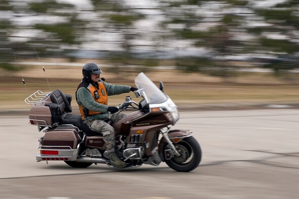 Tech. Sgt. John Thompson, 434th Aircraft Maintenance Squadron crew chief, rides his motorcycle at Grissom Air Reserve Base, Ind., March 20, 2015. Thompson has been riding for 33 years and uses his experience and training to educate other riders. (U.S. Air Force photo/Tech. Sgt. Benjamin Mota) 