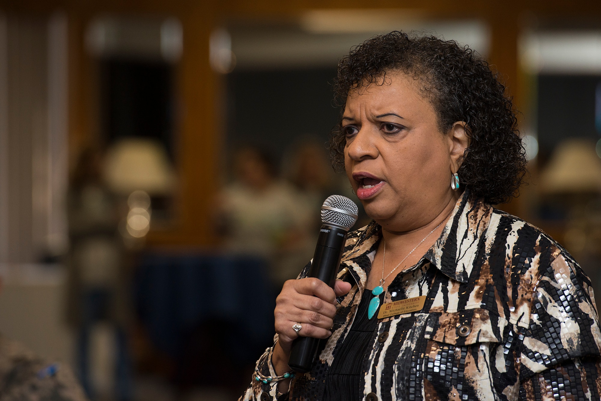 Michaelle Kitchen, Midwestern State University associate professor of counseling, kinesiology and special education, delivers a speech at Sheppard Air Force Base, Texas, March 24, 2015. Kitchen’s speech was part of the first Women’s Conference at Sheppard and educated Airmen about the cultural differences people may encounter and how to appreciate them. (U.S. Air Force photo by Senior Airman Kyle Gese/Released)