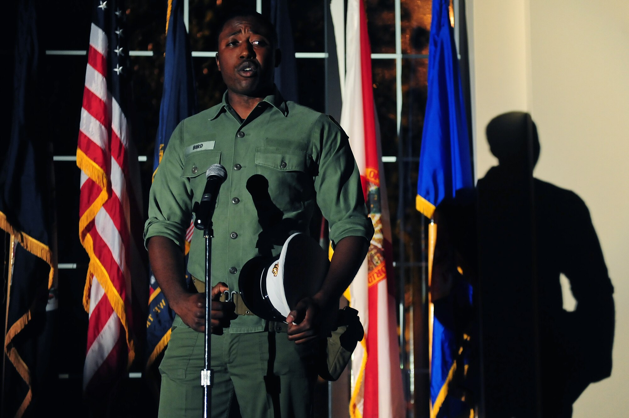 Airman Mitchell Dixon, 4th Component Maintenance Squadron aerospace propulsion technician, participates in a dramatic presentation during the Seymour Johnson Air Force Base Air Force Ball, Sept. 20, 2014, at Seymour Johnson AFB, North Carolina. The event featured a performance entitled "Moments In Time" by Airmen throughout the wing portraying fictional characters telling their stories of losing loved ones in combat or the line of duty. (U.S. Air Force photo/Airman 1st Class Brittain Crolley)