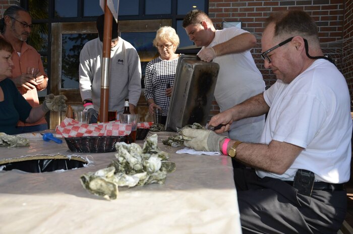 More than 30 people came out to The Charleston Club at Joint Base Charleston, S.C., on March 20, 2015 to enjoy The Club's Oyster Roast. Oyster roasts are a lowcountry tradition, with oyster season runs from early October through April. (Courtesy Photo / Jessica Donnelly)