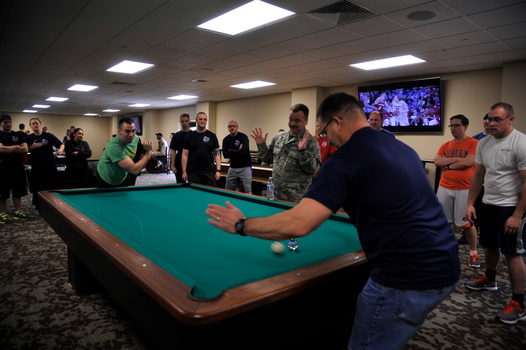 Team Fairchild members play ‘Crud’ during Winter Sports Day, March 20, 2015, in the Red Morgan Center at Fairchild Air Force Base, Wash. Crud is a game based around billiards that is commonly played by military members and was one of many sports Airmen could participate in. (U.S. Air Force photo/Airman 1st Class Taylor Bourgeous)
