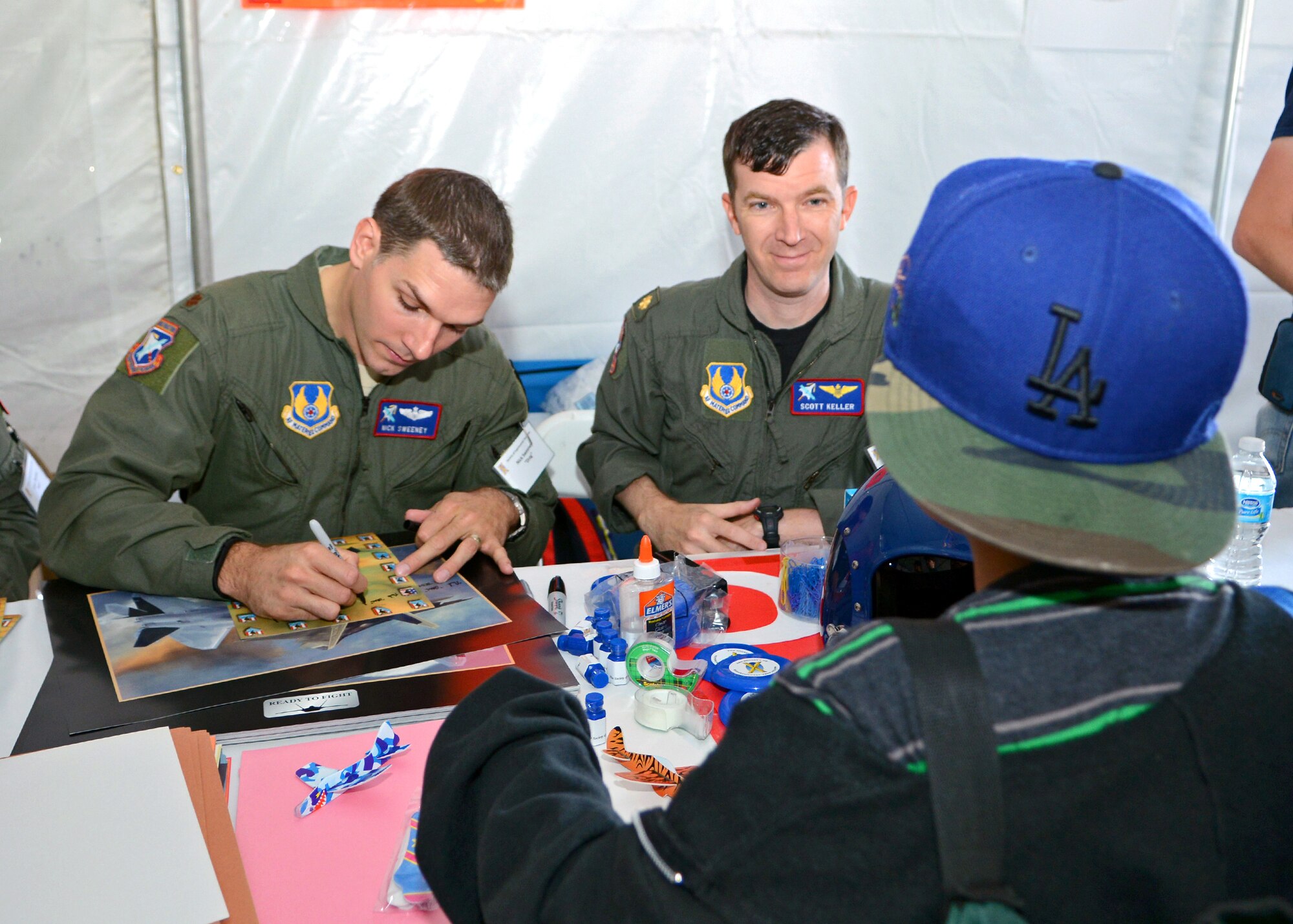 Test pilots from Edwards Air Force Base, Calif., were inside the STEM tent signing posters and pictures during the 2015 Los Angeles County Air Show held March 21 and 22 at William J. Fox Airfield in Lancaster, Calif. (U.S. Air Force photo by Jet Fabara)