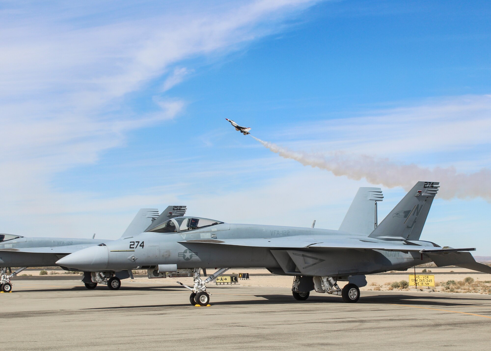 A U.S. Navy F/A-18 Super Hornet from Naval Air Station Lemoore, California, sits on the Fox Field flightline as the U.S. Air Force Thunderbirds practice March 20. (U.S. Air Force photo by Melissa Buchanan)