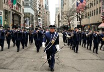 U.S. Air Force Senior Master Sgt. John E. Christ, drum major with the 553rd Air Force Band, leads the Air National Guard Band of the Northeast during a performance in the New York City St. Patrick's Day Parade in New York March 17, 2015. The band played for spectators along the parade’s Fifth Avenue route as part of its community relations mission. (U.S. Air National Guard photo by Staff Sgt. Lealan Buehrer/Released)