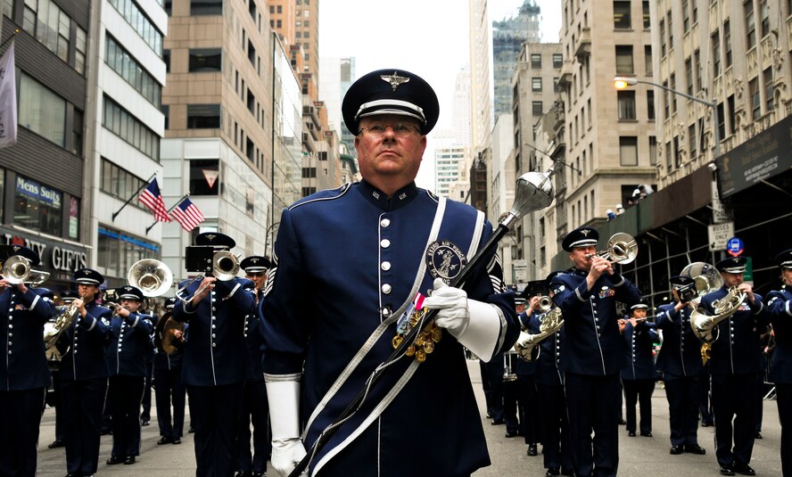 U.S. Air Force Senior Master Sgt. John E. Christ, drum major with the 553rd Air Force Band, leads the Air National Guard Band of the Northeast during a performance in the New York City St. Patrick's Day Parade in New York March 17, 2015. The band played for spectators along the parade’s Fifth Avenue route as part of its community relations mission. (U.S. Air National Guard photo by Staff Sgt. Lealan Buehrer/Released)