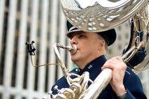 U.S. Air Force Tech. Sgt. Gregory S. Dunn, an instrumentalist with the 566th Air Force Band, performs with the Air National Guard Band of the Northeast in the New York City St. Patrick's Day Parade in New York March 17, 2015. The band played for spectators along the parade’s Fifth Avenue route as part of its community relations mission. (U.S. Air National Guard photo by Staff Sgt. Lealan Buehrer/Released)