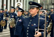 U.S. Air Force Senior Airman Sarah J. Carlson, an instrumentalist with the 566th Air Force Band, performs with the Air National Guard Band of the Northeast in the New York City St. Patrick's Day Parade in New York March 17, 2015. The band played for spectators along the parade’s Fifth Avenue route as part of its community relations mission. (U.S. Air National Guard photo by Staff Sgt. Lealan Buehrer/Released)