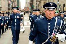 U.S. Air Force Senior Master Sgt. John E. Christ, drum major with the 553rd Air Force Band, leads the Air National Guard Band of the Northeast during a performance in the New York City St. Patrick's Day Parade in New York March 17, 2015. The band played for spectators along the parade’s Fifth Avenue route as part of its community relations mission. (U.S. Air National Guard photo by Staff Sgt. Lealan Buehrer/Released)