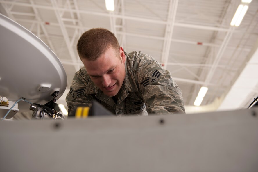 Senior Airman Jacob Beilke, 49th Aircraft Maintenance Squadron Avionic specialist journeyman, removes the batteries in a MQ-9 Reaper during a 28-Day Inspection at Holloman Air Force Base, N.M. March 18, 2015. A 28-Day Inspection is a time compliance inspection to replace the secondary power source, the batteries. (U.S. Air Force photos by Staff Sgt. E’Lysia A. Wray/Released)