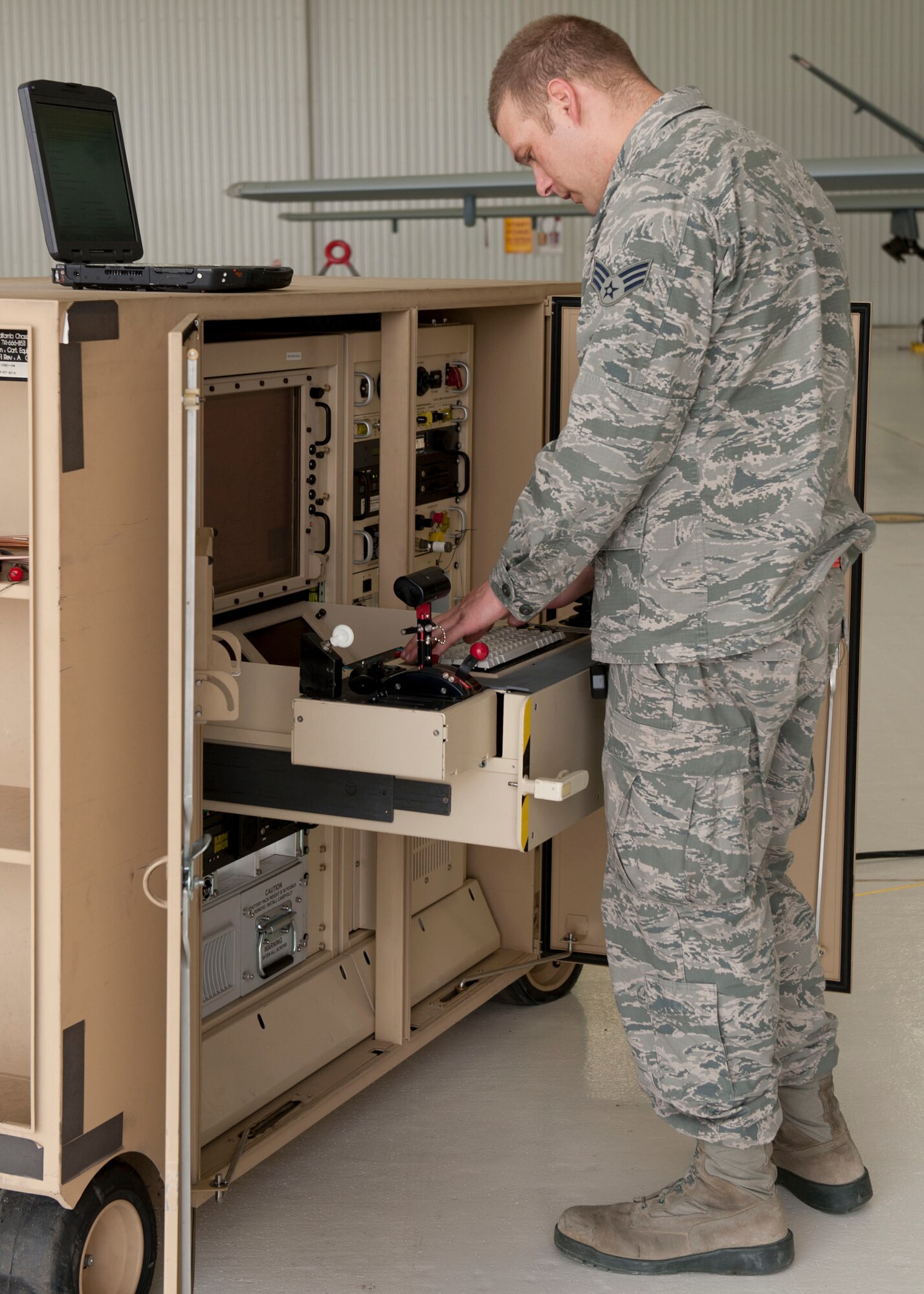 Senior Airman Jacob Beilke, 49th Aircraft Maintenance Squadron Avionic specialist journeyman, completes an operational check using a Ruggedized Aircraft Maintenance Test Station (RAMTS) at Holloman Air Force Base, N.M. March 18, 2015. Operational checks are conducted after any maintenance on an aircraft to ensure all the aircraft’s components work properly. (U.S. Air Force photo by Staff Sgt. E’Lysia A. Wray/Released)