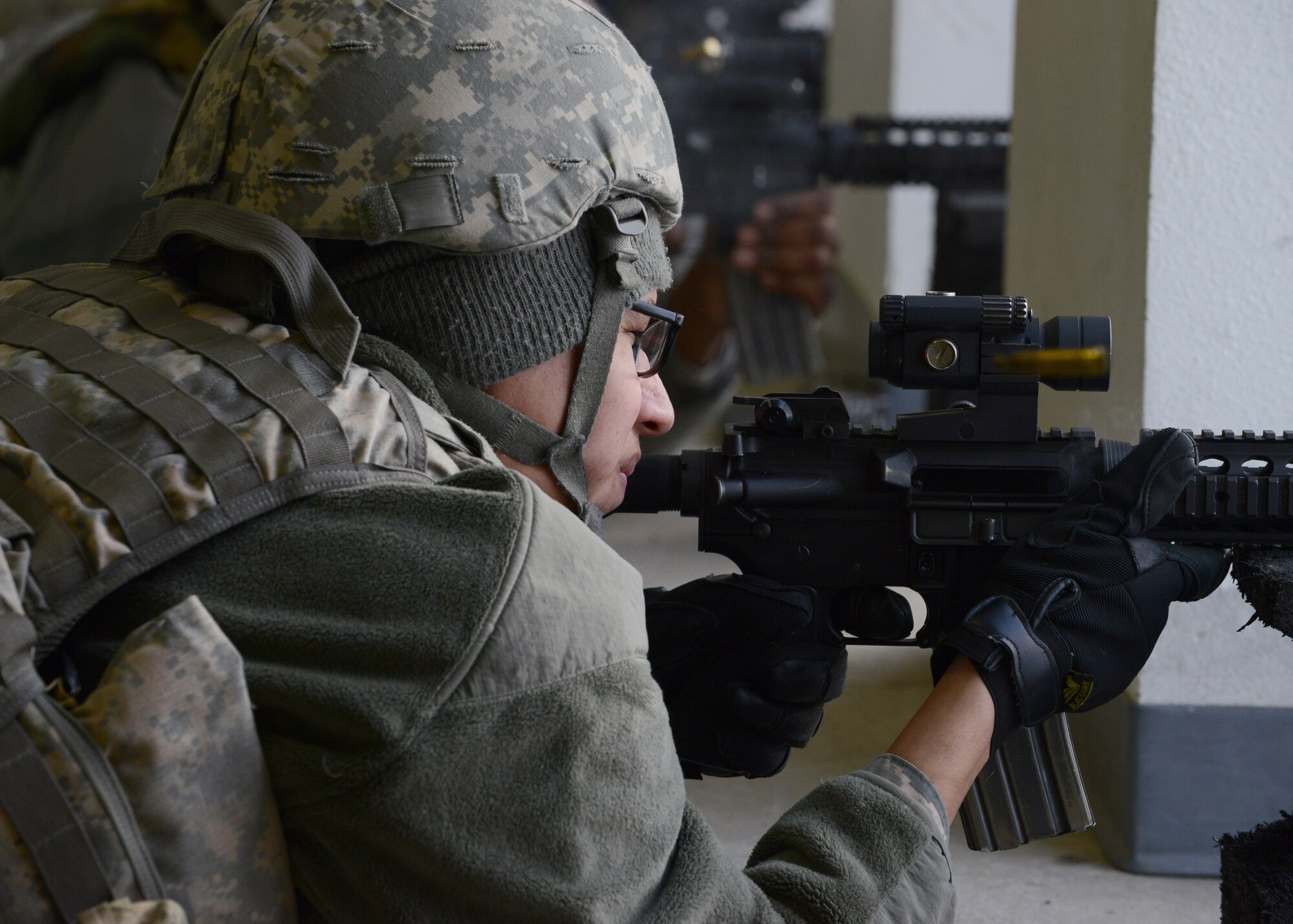 U.S. Air Force Airman 1st Class Angel Saenz, a 354th Civil Engineer Squadron water fuels system maintenance journeyman, fires an M4 carbine at the Combat Arms Training and Maintenance outdoor range Feb. 12, 2015, Eielson Air Force Base, Alaska. Saenz attended an M4 requalification course.  (U.S. Air Force photo by Senior Airman Ashley Taylor/Released)