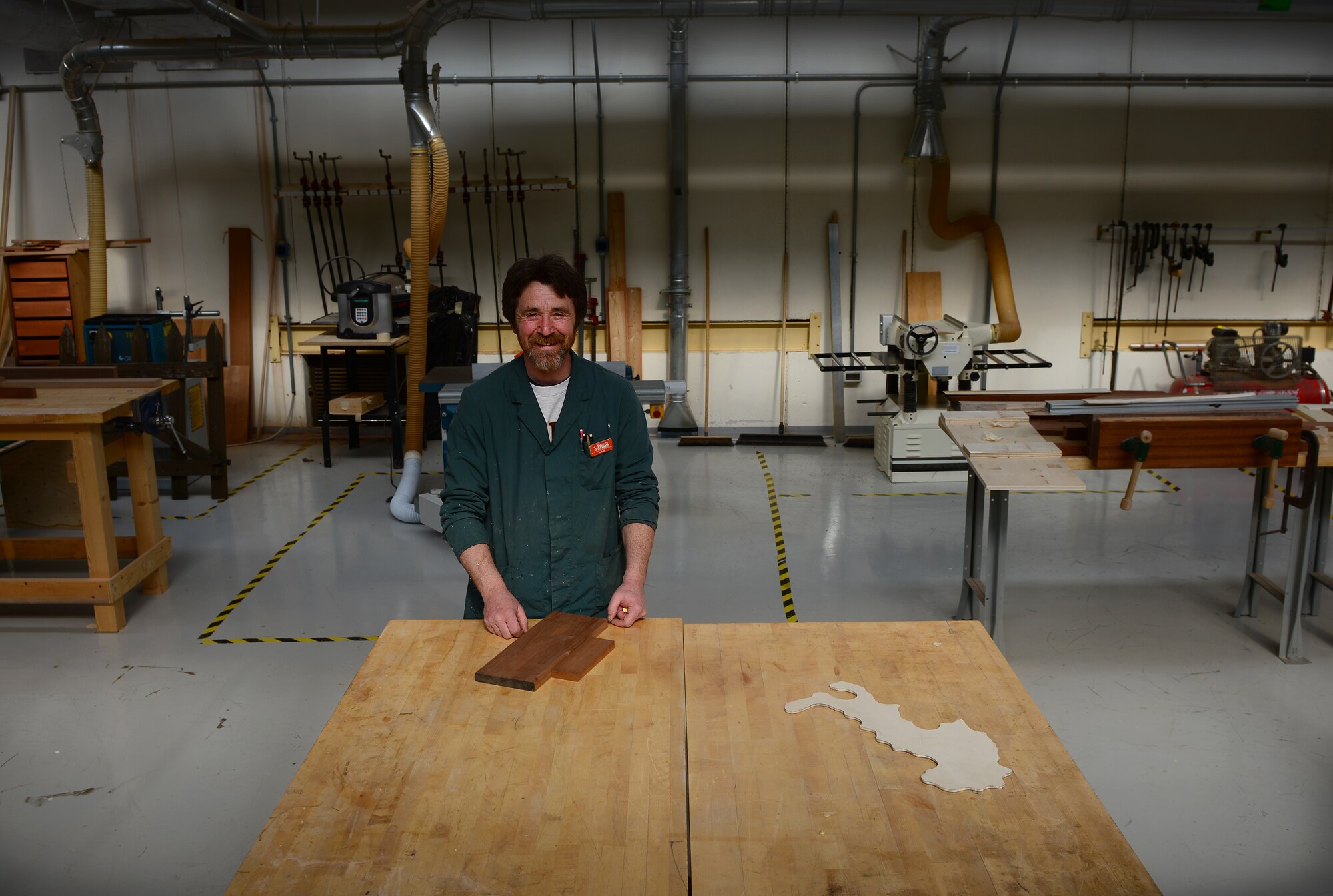 Stefano De Bortoli, 31st Force Support Squadron wood hobby shop manager, has been working at the shop for more than 10 years at Aviano Air Base, Italy. Bortoli provides wood working services and assists customers that use any self-help machinery and tools. (U.S. Air Force photo by Senior Airman Matthew Lotz/Released)