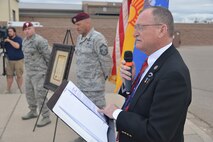 Roger Newell, Albuquerque’s liason for veterans, reads a proclamation at the Drug Enforcement Agency Maltz Challenge. The competition honored fallen pararescueman Master Sgt. Michael Maltz, as well as Albuquerque native Army Pfc. Zachary Lovejoy, an Army paratrooper killed in 2010 in Afghanistan. The event was March 20 at the Air Force Pararescue and Combat Rescue Gym. (Photo by Todd Berenger)