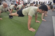 Participants in the Drug Enforcement Agency Maltz Challenge were tasked with several fitness activities, including push ups.  The competition honored fallen pararescueman Master Sgt. Michael Maltz, as well as Albuquerque native Army Pfc. Zachary Lovejoy, an Army paratrooper killed in 2010 in Afghanistan. The event was March 20 at the Air Force Pararescue and Combat Rescue Gym. (Photo by Todd Berenger)