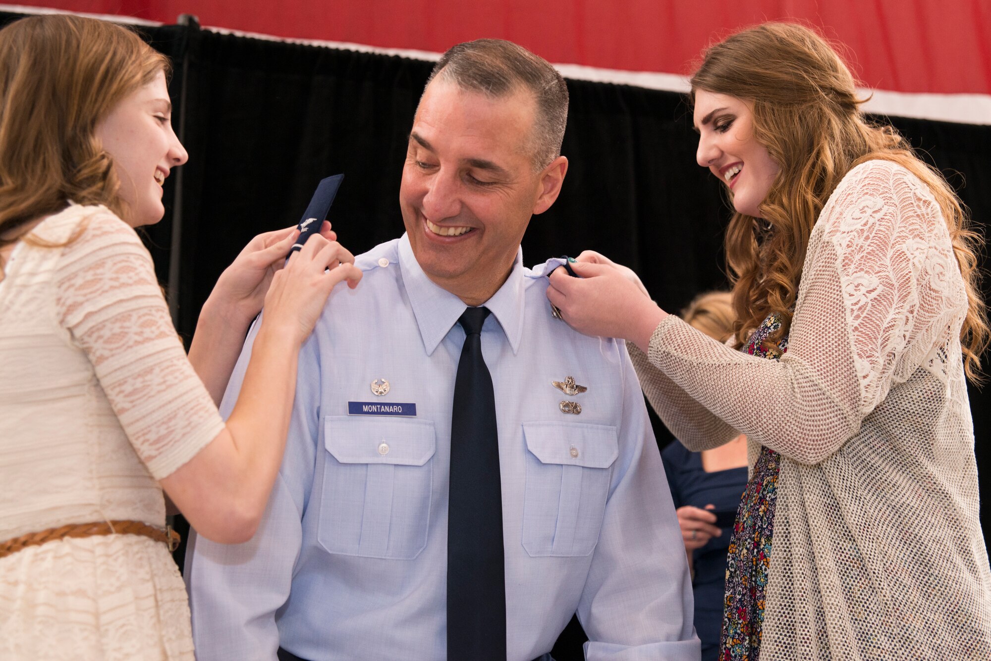 Congratulations to Col. Montanaro on his promotion! Here, his daughters Rachel and Ashley pin on his new rank of colonel during his promotion ceremony held at hangar 207 on Saturday Mar. 7, 2015.