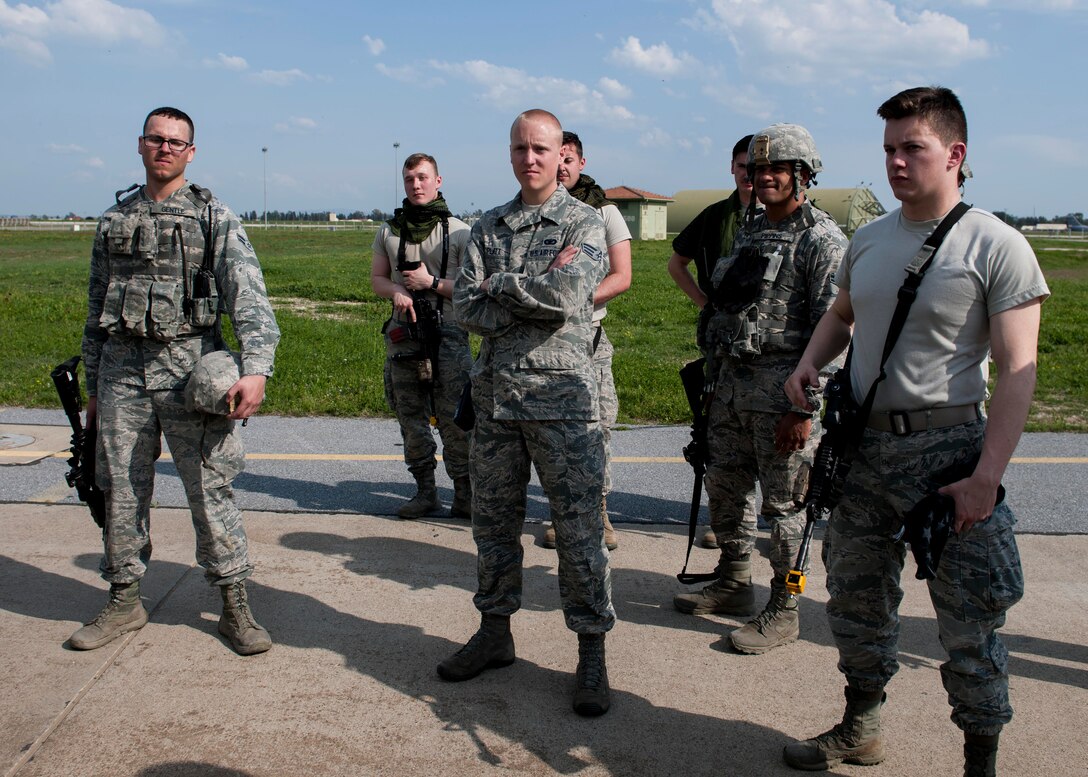 Airmen from the 39th Security Forces Squadron gather to discuss their performance during a force-on-force exercise March 18, 2015, at Incirlik Air Base, Turkey. The Airmen completed the annual requirement with the aid of other 39th SFS members who acted as safety observers and opposing forces. (U.S. Air Force photo by Senior Airman Krystal Ardrey/Released)