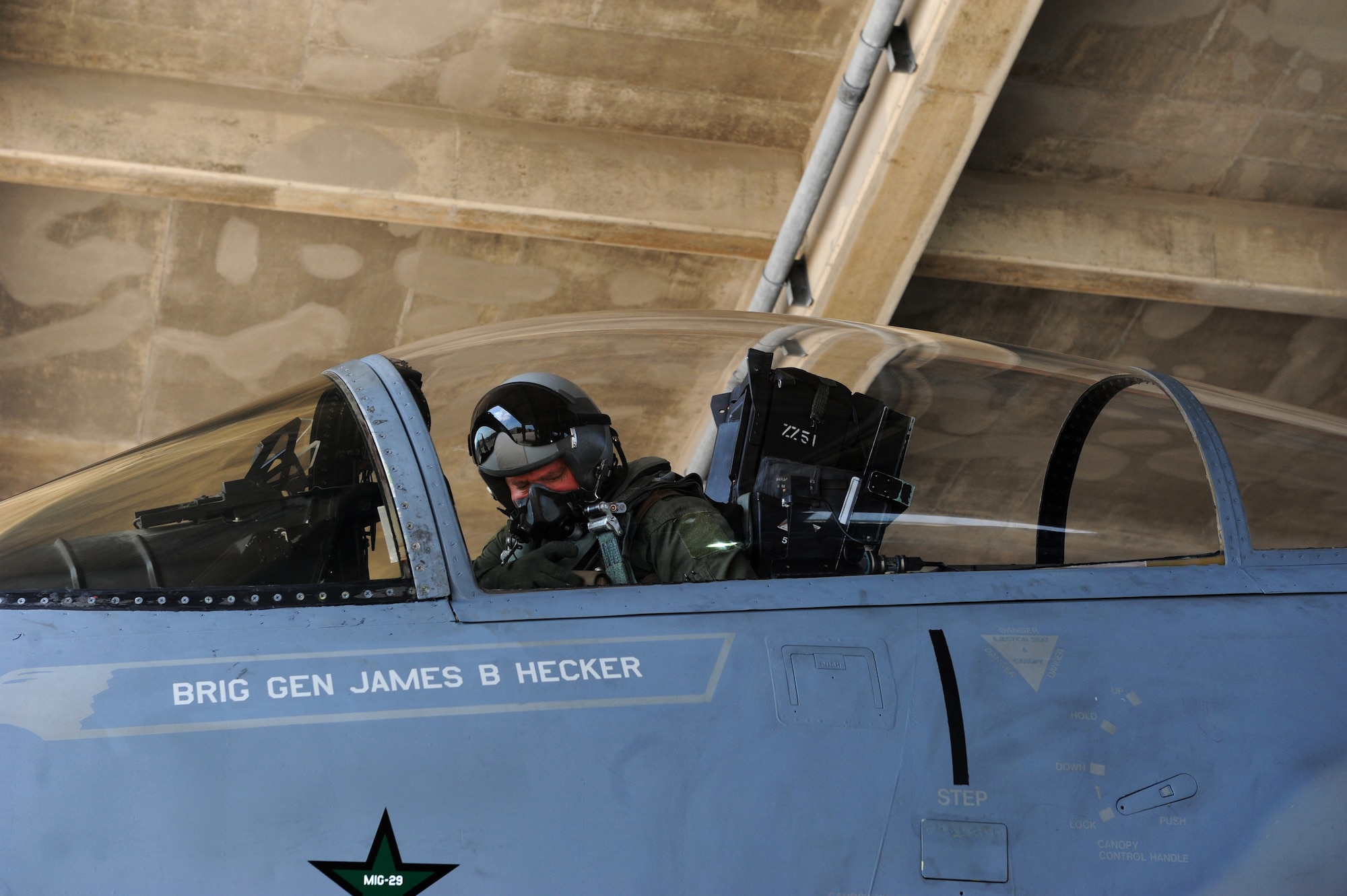 U.S. Air Force Brig. Gen. James B. Hecker prepares for his final flight as the 18th Wing commander on Kadena Air Base, Japan, March 24, 2015. Hecker was selected to be a major general and has been reassigned as the director of plans, programs, and requirements at Headquarters Air Combat Command on Joint Base Langley-Eustis, Virginia. Military aviators have a tradition where aircrew members upon completion of their final flight, or "fini flight" are met and hosed down with water by their squadron comrades, family, and friends. (U.S. Air Force photo by Airman 1st Class Stephen G. Eigel)