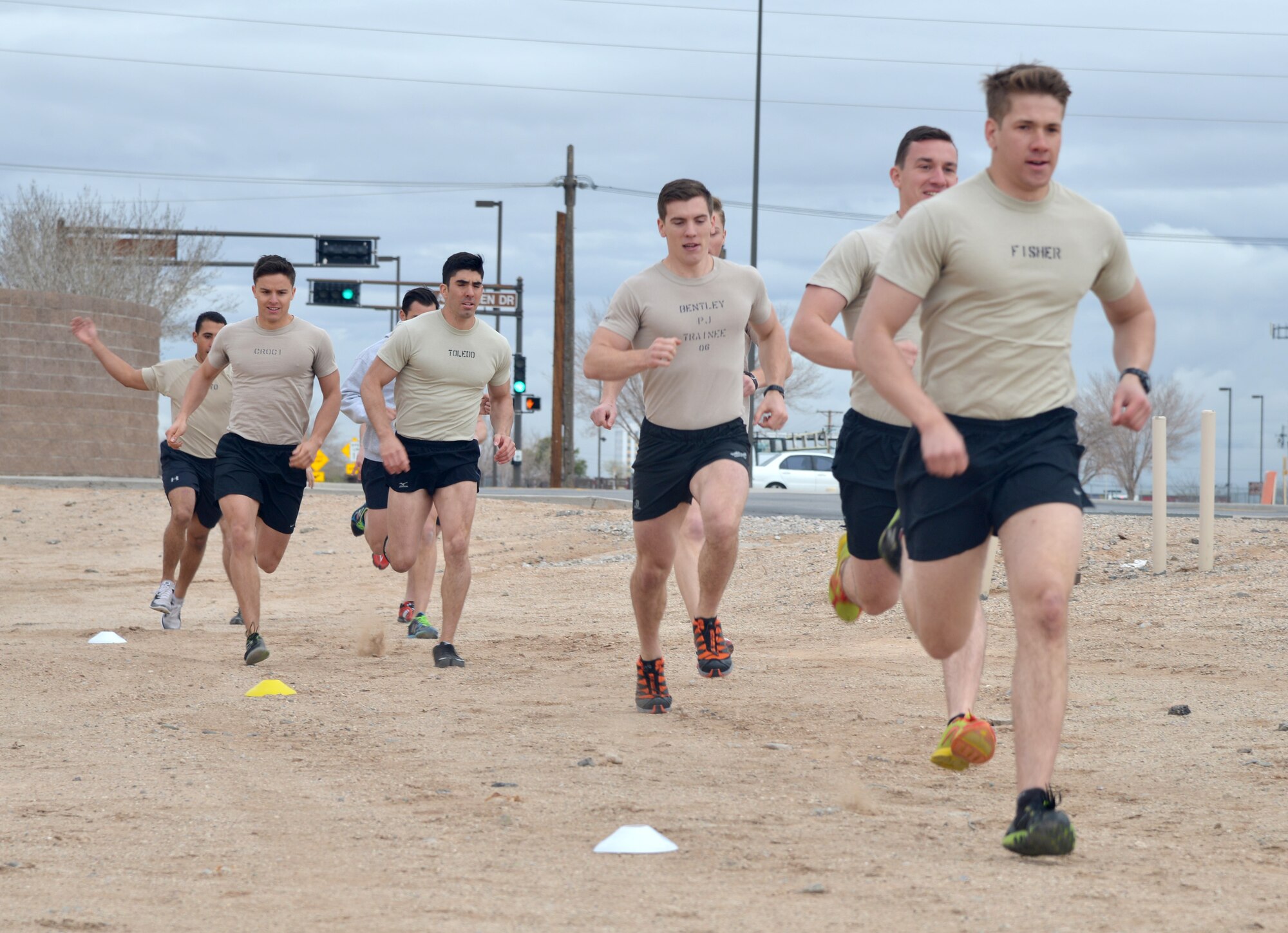 Participants in the Drug Enforcement Agency Maltz Challenge were tasked with several fitness activities, including a 400-meter run at Kirtland Air Force Base, New Mexico, March 20, 2015. The competition honored fallen pararescueman Master Sgt. Michael Maltz, as well as Albuquerque native Army Pfc. Zachary Lovejoy, an Army paratrooper killed in 2010 in Afghanistan. (U.S. Air Force photo by Todd Berenger)