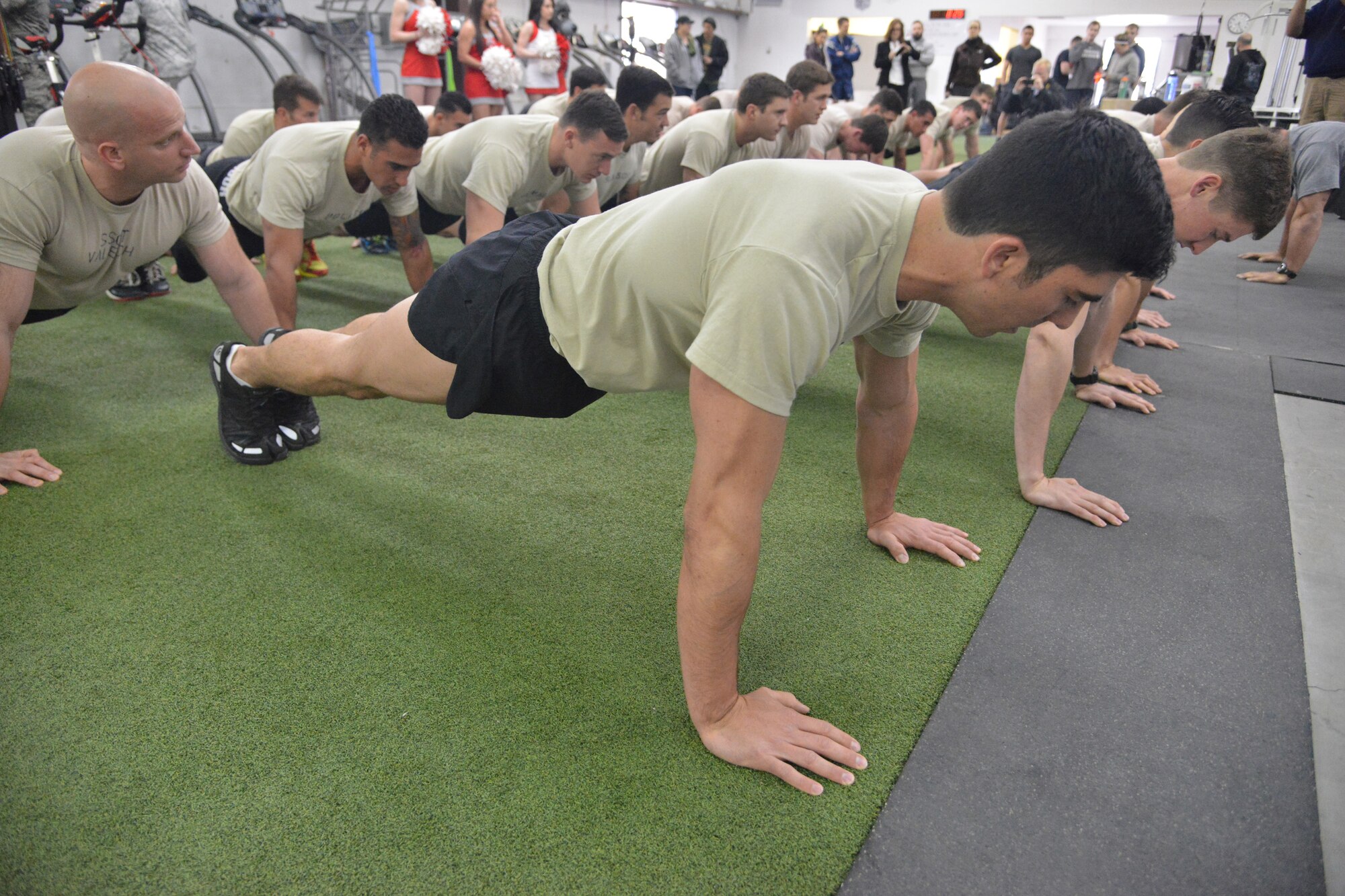 Participants in the Drug Enforcement Agency Maltz Challenge were tasked with several fitness activities, including push ups at Kirtland Air Force Base, New Mexico, March 20, 2015. The competition honored fallen pararescueman Master Sgt. Michael Maltz, as well as Albuquerque native Army Pfc. Zachary Lovejoy, an Army paratrooper killed in 2010 in Afghanistan. (U.S. Air Force photo by Todd Berenger)
