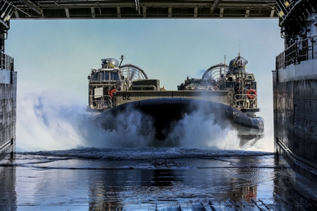 Navy landing craft air cushion 82 heads into the well deck of the USS Anchorage during a training exercise off the coast of San Diego, March 23, 2015. The landing craft air cushion is assigned to Assault Craft Unit 5.