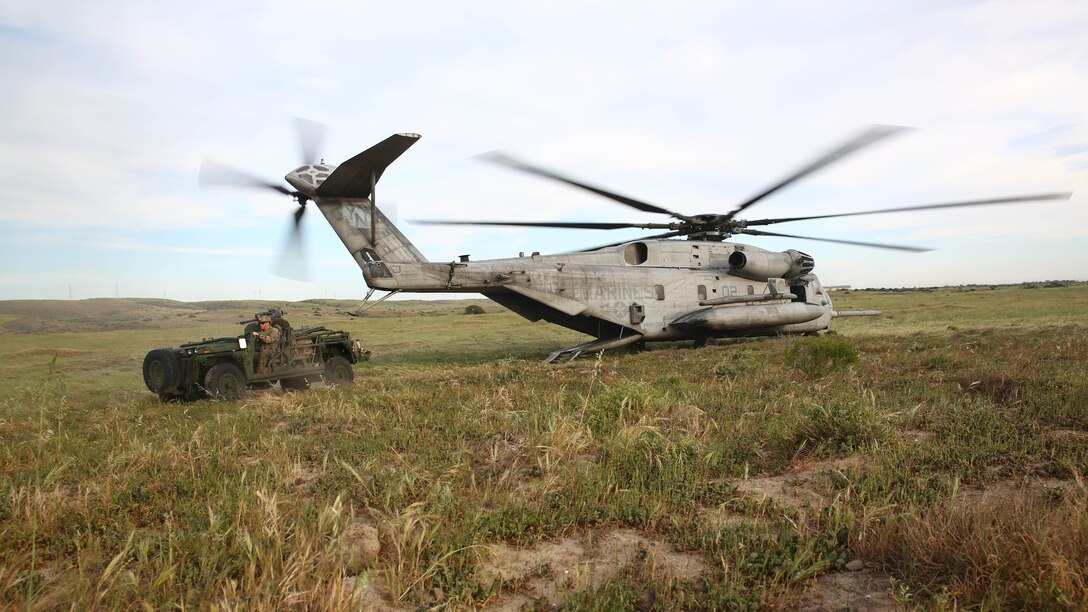 A CH-53E Super Stallion inserts a team of reconnaissance Marines with Force Company, 1st Reconnaissance Battalion, 1st Marine Division, during a training exercise aboard Marine Corps Base Camp Pendleton, Calif., March 16, 2015. The Marines were honing their insertion capabilities with an Internally Transportable Vehicle.