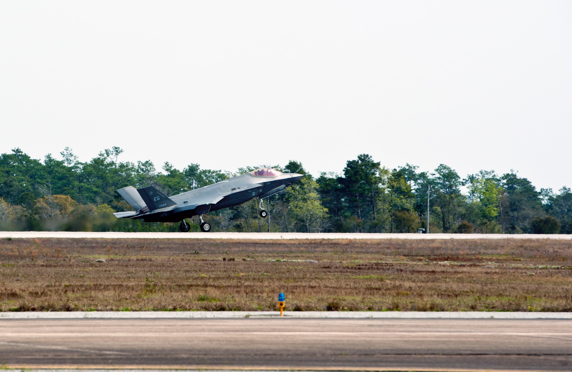 Royal Australian Air Force Squadron Leader Andrew Jackson, F-35 Lightning II student pilot, lands his F-35A after completing his first flight on Eglin Air Force Base, Fla., March 18, 2015. Jackson arrived in the United States in December 2014 and started his training at the F-35 Academic Training Center on Jan. 26, Australia Day. Since then, Jackson has completed 154 classroom hours and 64 hours throughout 16 flight simulations, before stepping to his first aircraft. (U.S. Air Force photo/Staff Sgt. Marleah Robertson)