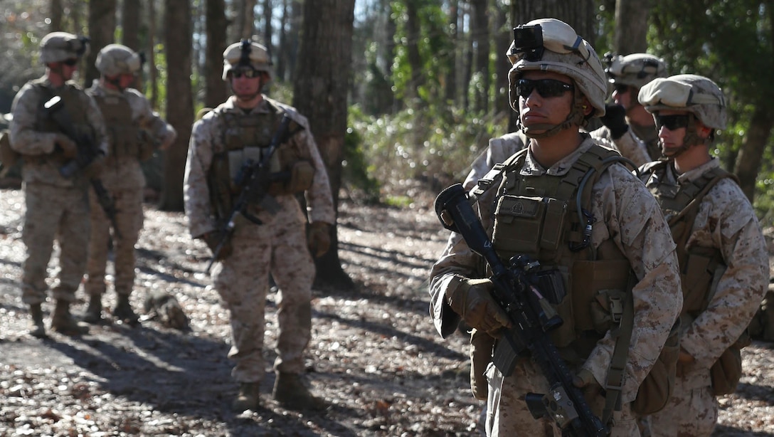 Marines with Easy Company, 2nd Battalion, 2nd Marine Regiment, patrol through the woods to reach their objective during a squad training exercise aboard Camp Lejeune, N.C., March 18, 2015. The training was designed to assist infantry squads by improving their ability to communicate and maneuver. 
