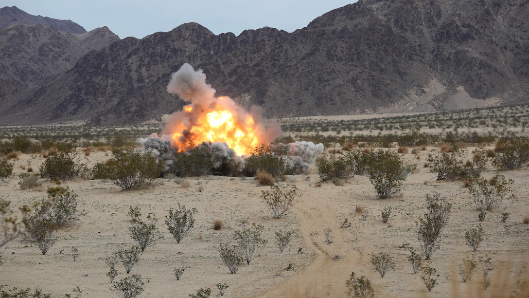 A cratering charge is detonated by Marines with Engineer Platoon, Headquarters and Service Company, Ground Combat Element Integrated Task Force, during a Marine Corps Operational Test and Evaluation Activity assessment at Range 108, Marine Corps Air Ground Combat Center Twentynine Palms, California, March 22, 2015. From October 2014 to July 2015, the GCEITF will conduct individual and collective level skills training in designated ground combat arms occupational specialties in order to facilitate the standards-based assessment of the physical performance of Marines in a simulated operating environment performing specific ground combat arms tasks. 