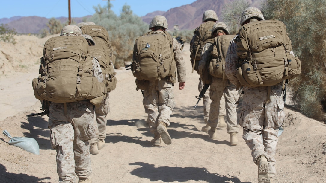 Marines with Engineer Platoon, Headquarters and Service Company, Ground Combat Element Integrated Task Force, conduct a four and a half mile hike to Range 110, Marine Corps Air Ground Combat Center Twentynine Palms, California, March 23, 2015. From October 2014 to July 2015, the GCEITF will conduct individual and collective level skills training in designated ground combat arms occupational specialties in order to facilitate the standards-based assessment of the physical performance of Marines in a simulated operating environment performing specific ground combat arms tasks. 