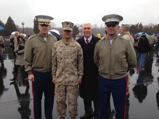 Indiana Gov. Mike Pence, second from right, joins his son, Marine 2nd Lt. Michael J. Pence, second from left, along with Maj. Geoffry M. Hollopeter, left, Recruiting Station Indianapolis commanding officer, and Sgt. Maj. Ronald E. Neff, right, RS Indianapolis sergeant major, during Michael Pence's Officer Candidate School graduation aboard Marine Corps Base Quantico, Virginia March 20, 2015. Michael Pence received his commission through OCS after graduating from Purdue University in 2014.