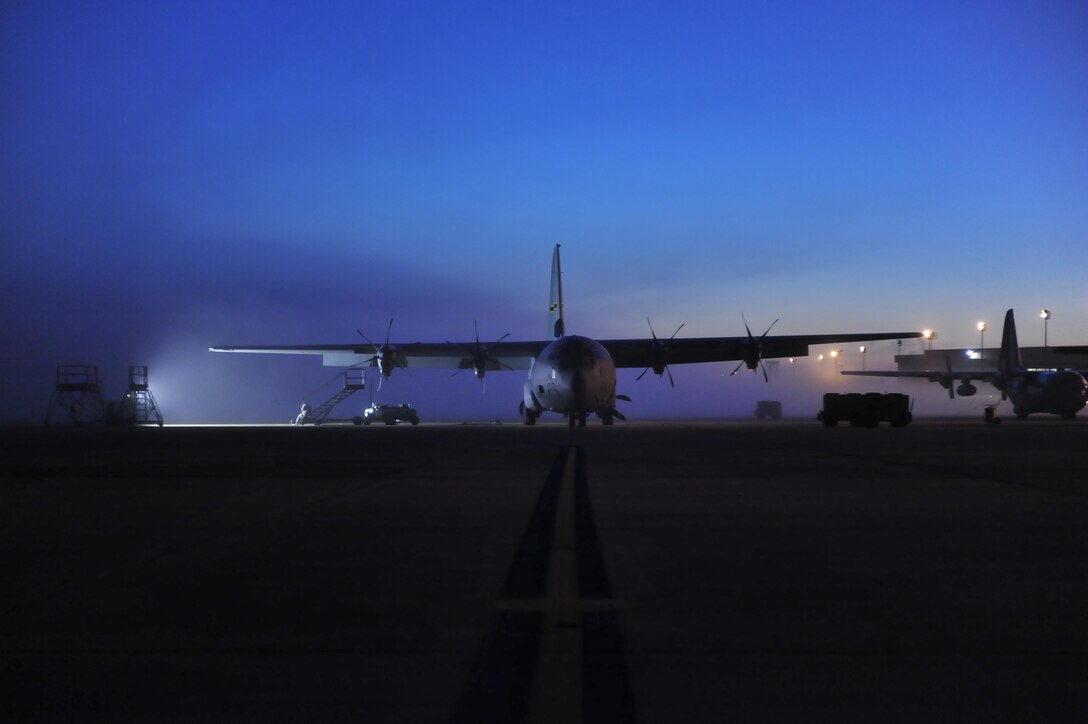 A C-130J sits on the flightline at dawn, awaiting maintenance March 16, 2015, at Little Rock Air Force Base, Ark. Little Rock is the home of C-130 combat airlift, with 22 percent of the total Air Force C-130 inventory residing at the base. (U.S. Air Force photo by Tech. Sgt. Russ Scalf)