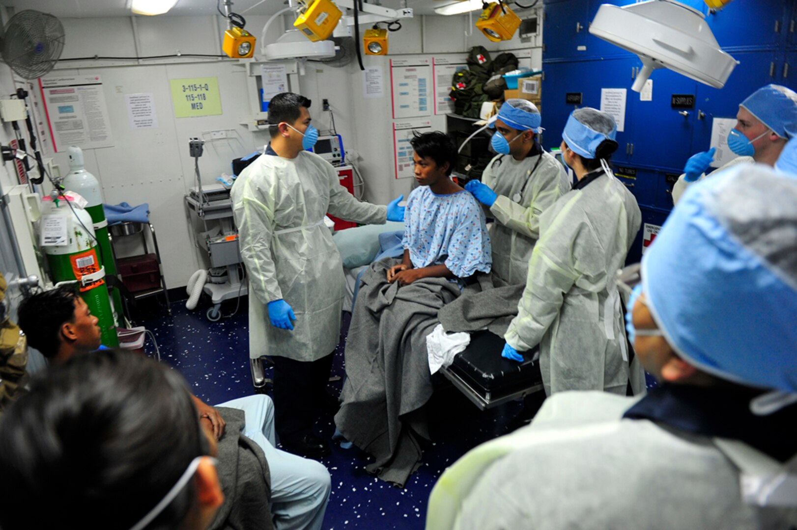 PHILIPPINE SEA(Mar. 25, 2015) - The Medical department, attached to the U.S. 7th Fleet flagship USS Blue Ridge (LCC 19),  provides medical treatment to five Filipino Nationals rescued after signaling for assistance. Blue Ridge is currently on patrol strengthening and fostering relationships within the Indo-Asian Pacific region. 